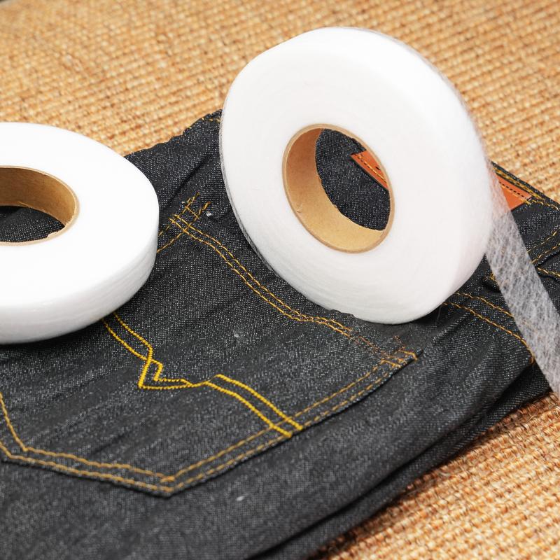 Fusible tape positioned inside a folded garment hem